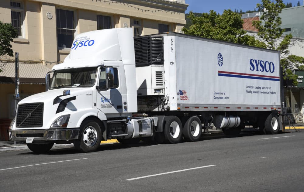 A Sysco truck makes a delivery to a restaurant in Ashland, Oregon. (Robert Alexander/Getty Images)