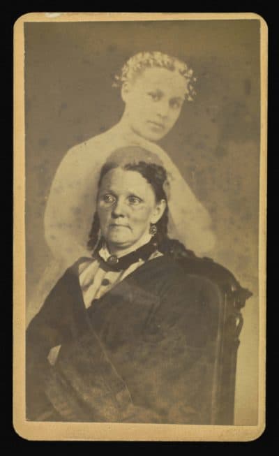 A photograph created by William Mumler, a spirit photographer who worked in Boston and New York in the mid-1800s. A woman is seated with a female spirit in background. (Sepia Times/Universal Images Group via Getty Images)