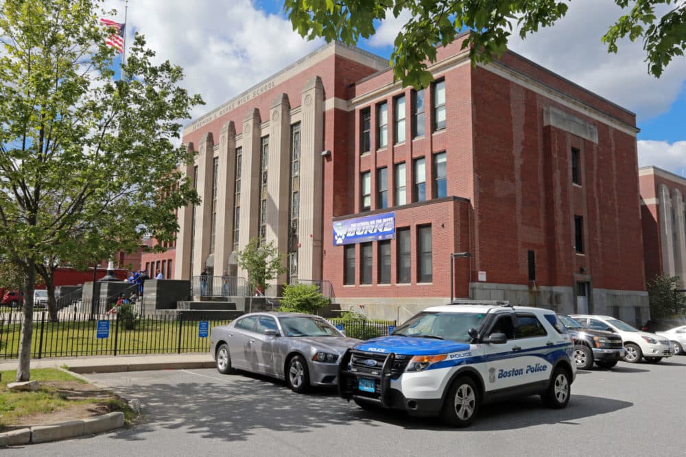 A BPD cruiser in the parking lot as students from the Jeremiah E Burke High School prepare to graduate in 2016. (Stuart Cahill/MediaNews Group/Boston Herald via Getty Images)