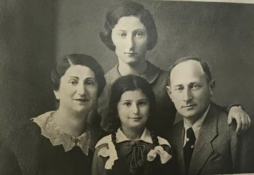 Hédi Fried, pictured standing in the back, with her family, including her younger sister Livia, seated, at their home in Romania in 1940. (Courtesy private family collection)
