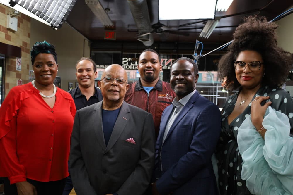 Host, Henry Louis Gates Jr., pose for photo in the barbershop with Naneka Brathwaite, Bernard Lumpkin, Julee Wilson, Dennis Mitchell Jr. and Joseph Ravenell while shooting "Making Black America: Through the Grapevine." (PBS)