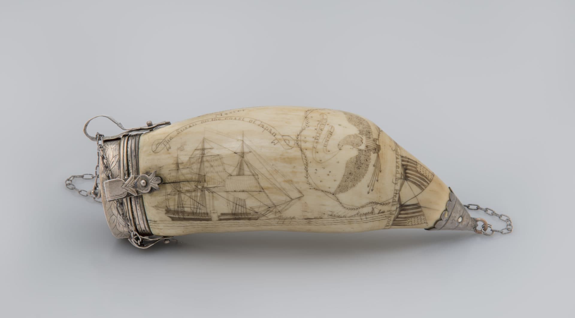 Frederick Myrick, &quot;Susan’s Tooth with silver mounts,&quot; February 23, 1829. Engraved on the ship Japan. Whale tooth. (Courtesy The Dietrich American Foundation Collection/Cahoon Museum of American Art)