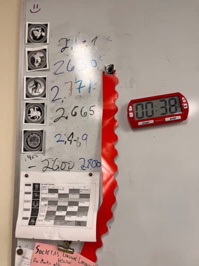 A timer in the author’s classroom used for tracking the number of minutes spent in Latin, with classes competing for the highest score. Oct. 2022. (Courtesy Abbi Holt)