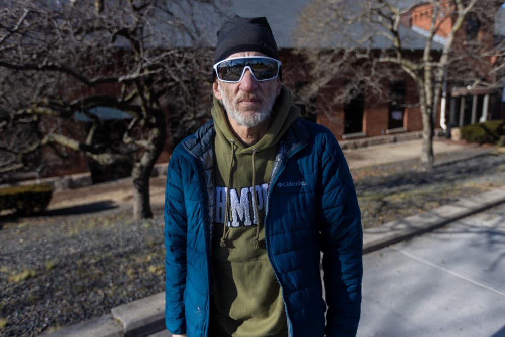 Mike, a participant in the study, stands outside Genoa Healthcare in Providence. (Jesse Costa/WBUR)