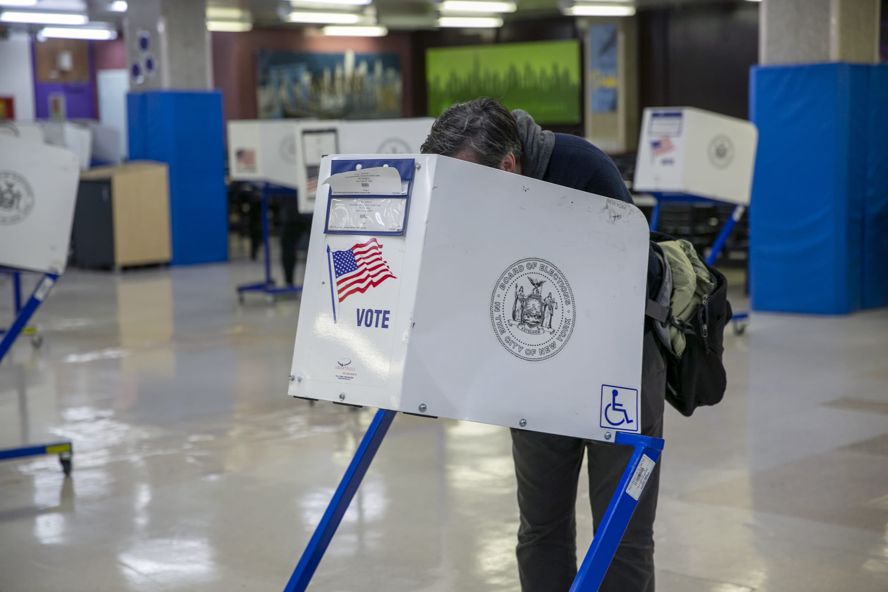 People in privacy booths vote in the midterm election at an early voting polling site. (Ted Shaffrey/AP)