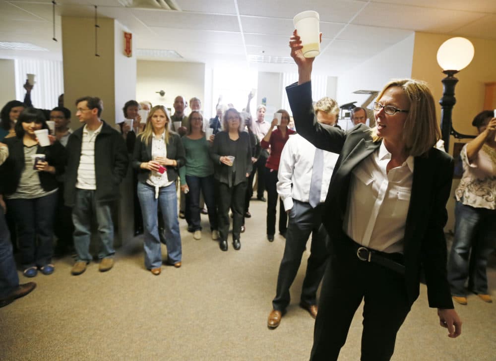 Nancy Barnes, then-Star Tribune editor, gave a toast to staff after the newspaper won two Pulitzer Prizes in 2013. (Jerry Holt/Star Tribune via Getty Images)