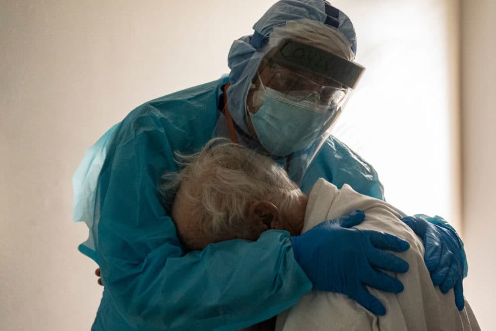 HOUSTON, TX - NOVEMBER 26: (EDITORIAL USE ONLY) Dr. Joseph Varon hugs and comforts a patient in the COVID-19 intensive care unit (ICU) during Thanksgiving at the United Memorial Medical Center on November 26, 2020 in Houston, Texas. According to reports, Texas has reached over 1,220,000 cases, including over 21,500 deaths. (Photo by Go Nakamura/Getty Images)