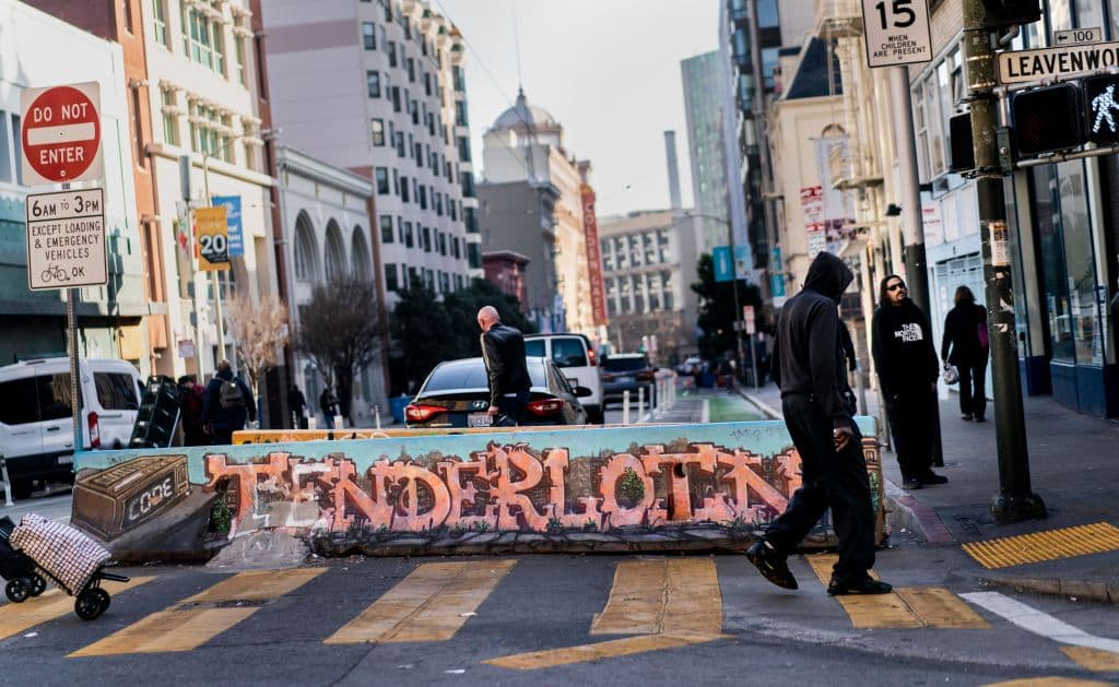 At the intersection of Leavenworth and Golden Gate Streets people all walk to work and hang out in the Tenderloin neighborhood of San Francisco, California Wednesday January 26, 2022. Mayor London Breeds efforts to cleanup the Tenderloin neighborhood over the past two years has increased in effort with her recent State of Emergency. (Photo by Melina Mara/The Washington Post via Getty Images)