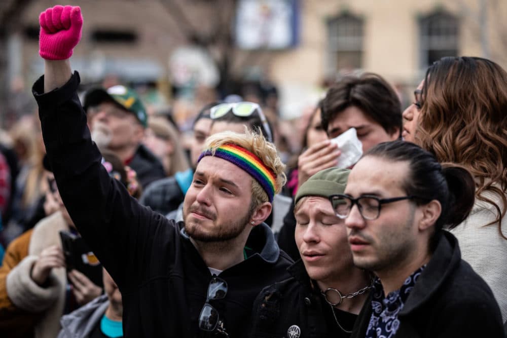 Mourners outside the Colorado Springs City Hall, where a rainbow flag was draped over the building on Nov. 23, 2022 in Colorado Springs, Colorado, in honor of the victims of a shooting at Club Q, an LGBTQ+ club where a gunman opened fire, killing five and injuring 25 others. (Chet Strange/Getty Images)