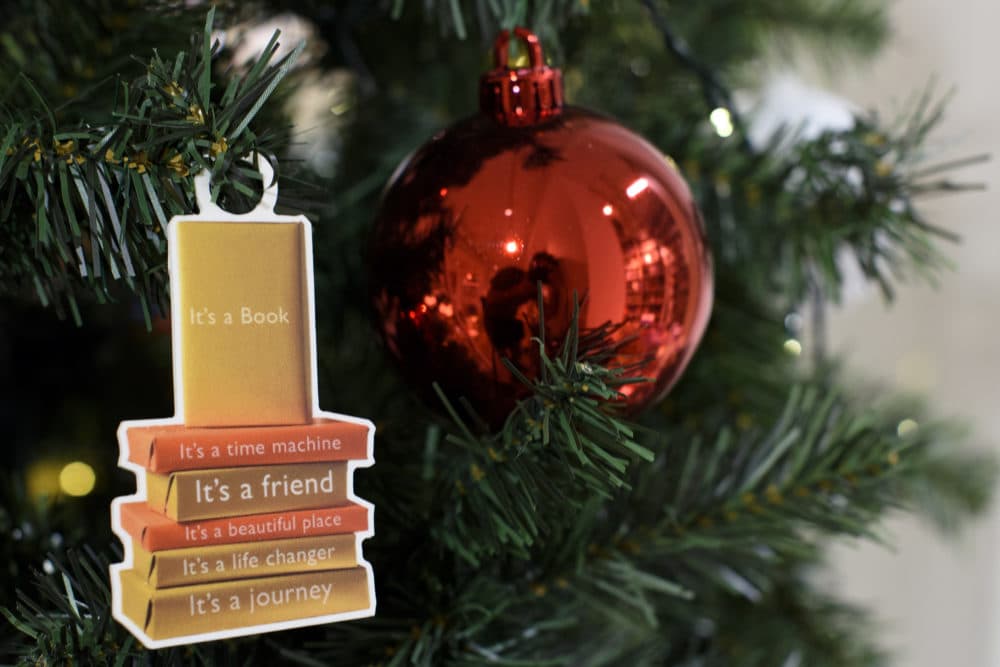 A Christmas tree sports a book ornament. (Ben Pruchnie/Getty Images)