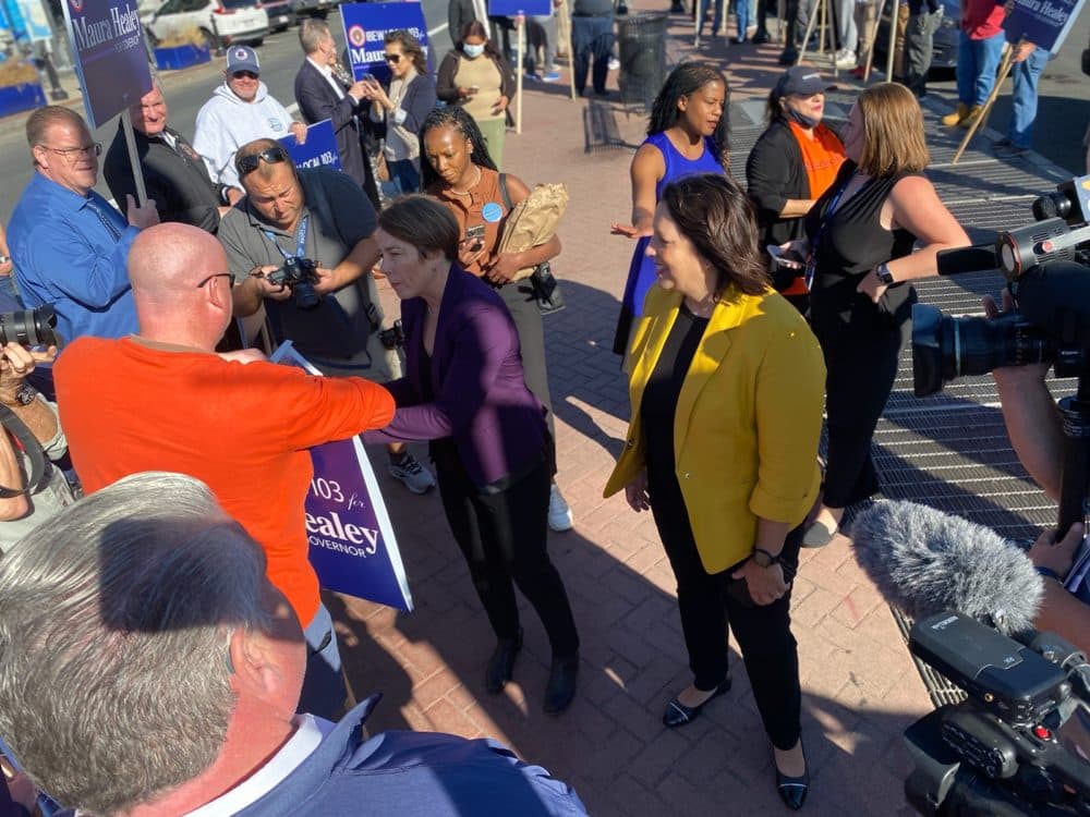 Maura Healey and Kim Driscoll greet union workers in Maverick Square in East Boston. (Anthony Brooks/WBUR)