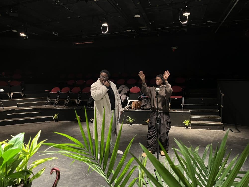 &quot;ALRIGHT&quot; co-curators Porsha Olayiwola (left) and Cierra Michele Peters confer during a rehearsal at the BCA's Plaza Theatre. (Amelia Mason/WBUR)