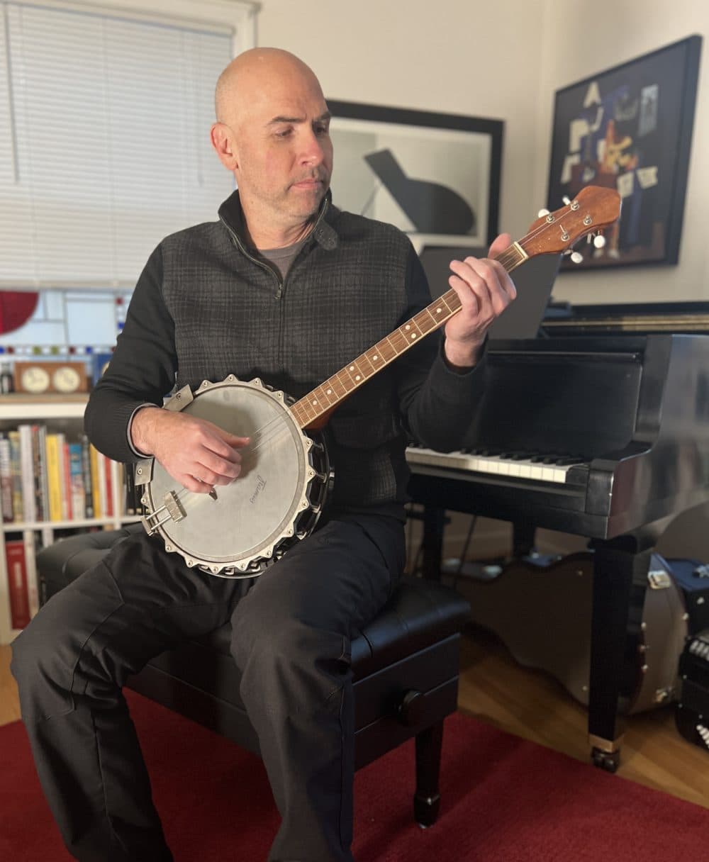Eric Shimelonis plays the tenor banjo: a four-stringed instrument with a thin membrane stretched over a frame. The circular membrane is typically made of plastic or animal skin. (Courtesy of Rebecca Sheir)
