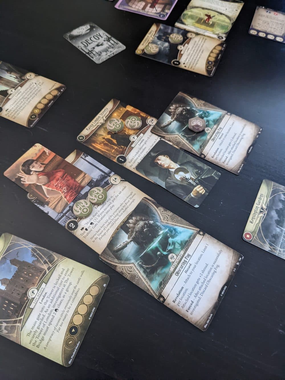 Investigators in &quot;Arkham Horror: The Card Game&quot; cooperate to avert cosmic disaster by traversing far-flung locations. (James Mastromarino/Here &amp; Now)