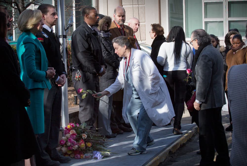 In this 2016 file photo, flowers are left outside the Brigham in honor of the slain Dr. Michael Davidson. (Robin Lubbock/WBUR)