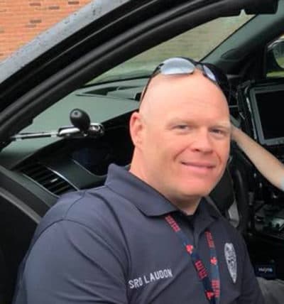 Blackstone officer David Laudon is shown next to a cruiser in a department photograph. (Photo: Blackstone Police Department)