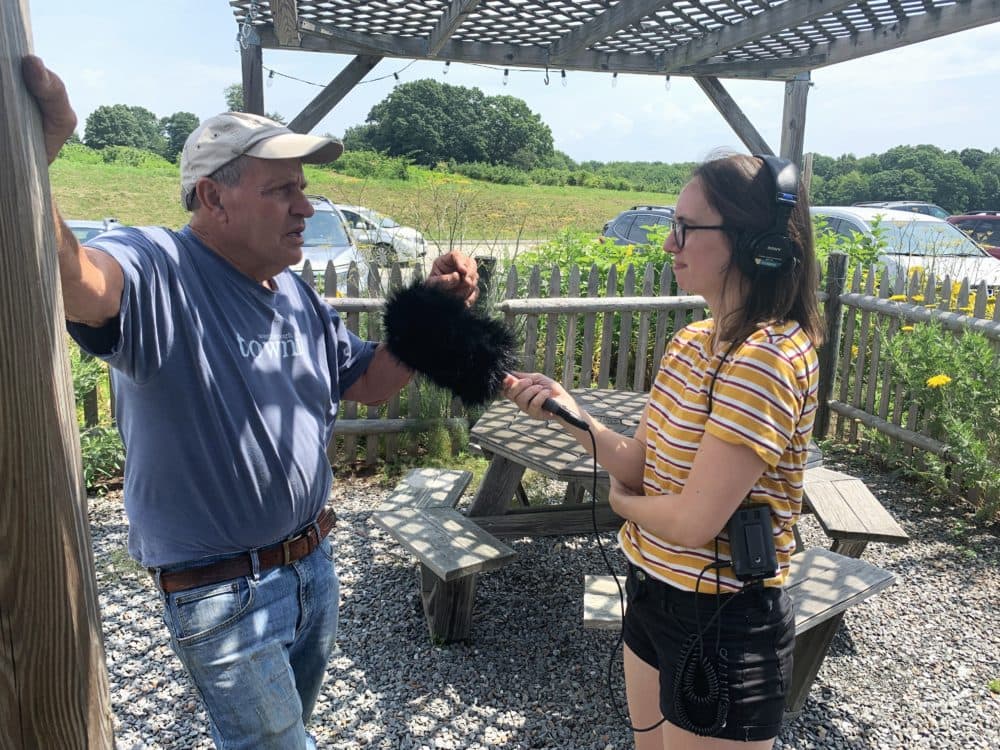 Reporter Amelia Mason interviews John Nourse about his knowledge on black raspberries. (Courtesy Jack Honeysett)