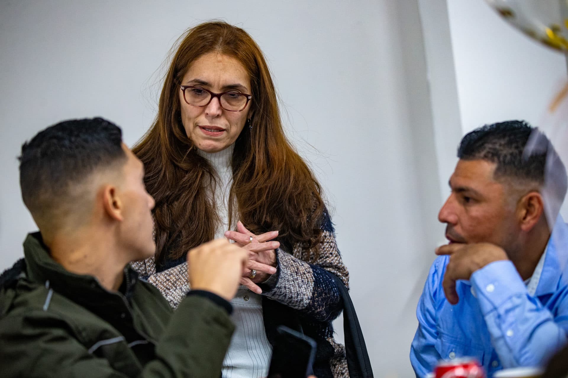 Denise Rincon has been helping Isabel Rodriguez's family since they arrived in Massachusetts this fall. (Jesse Costa/WBUR)