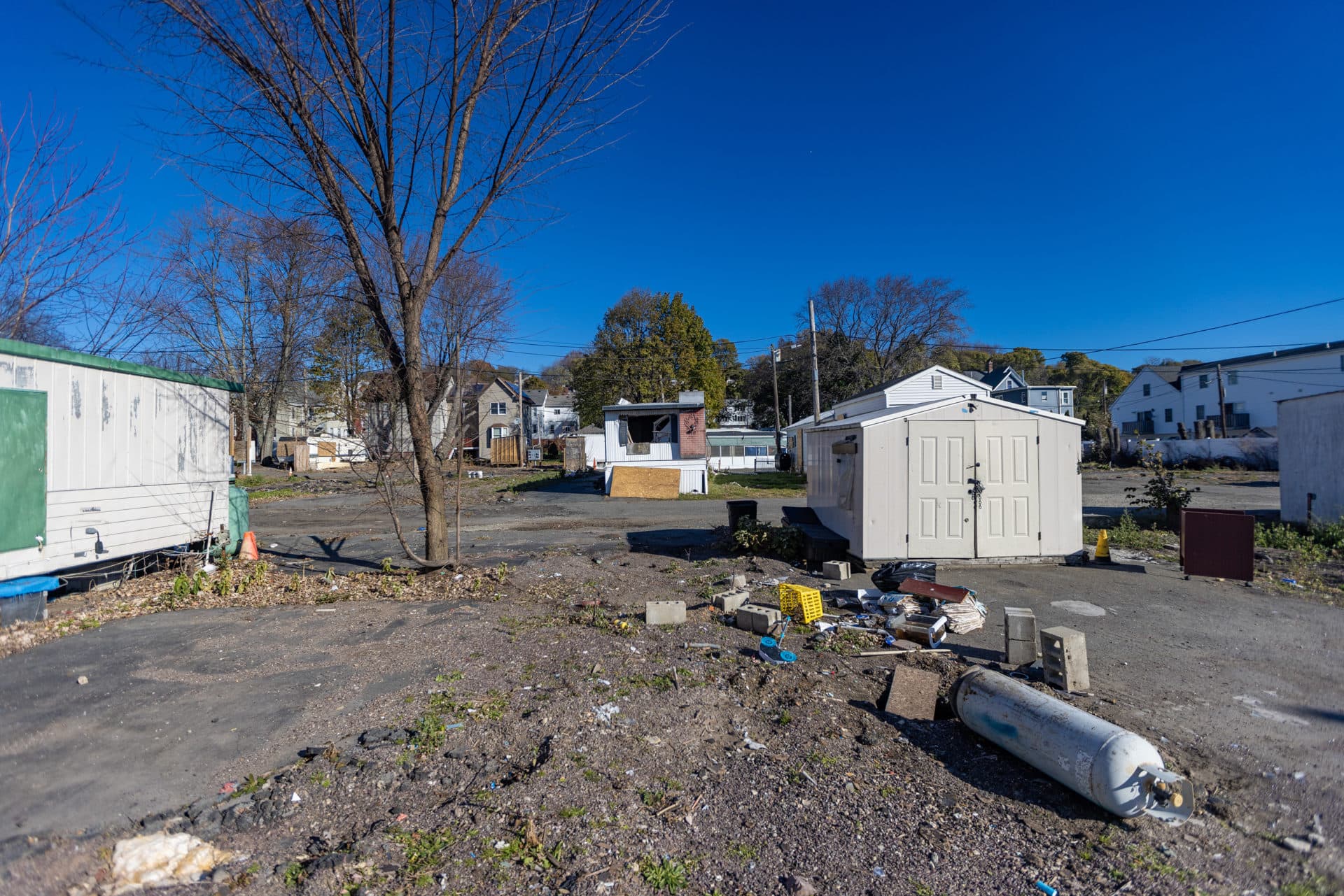 Boarded up and abandoned trailers at Lee's Trailer Park in Revere. (Jesse Costa/WBUR)