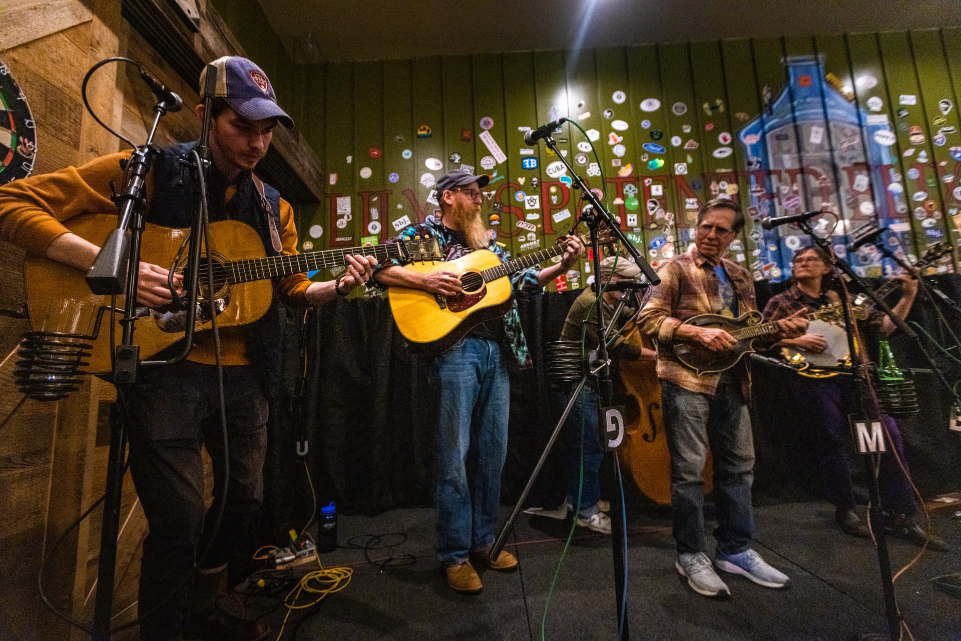A group of musicians from the audience take the stage to do a pick-up jam session on Bluegrass Tuesday at Lily P’s. (Jesse Costa/WBUR)