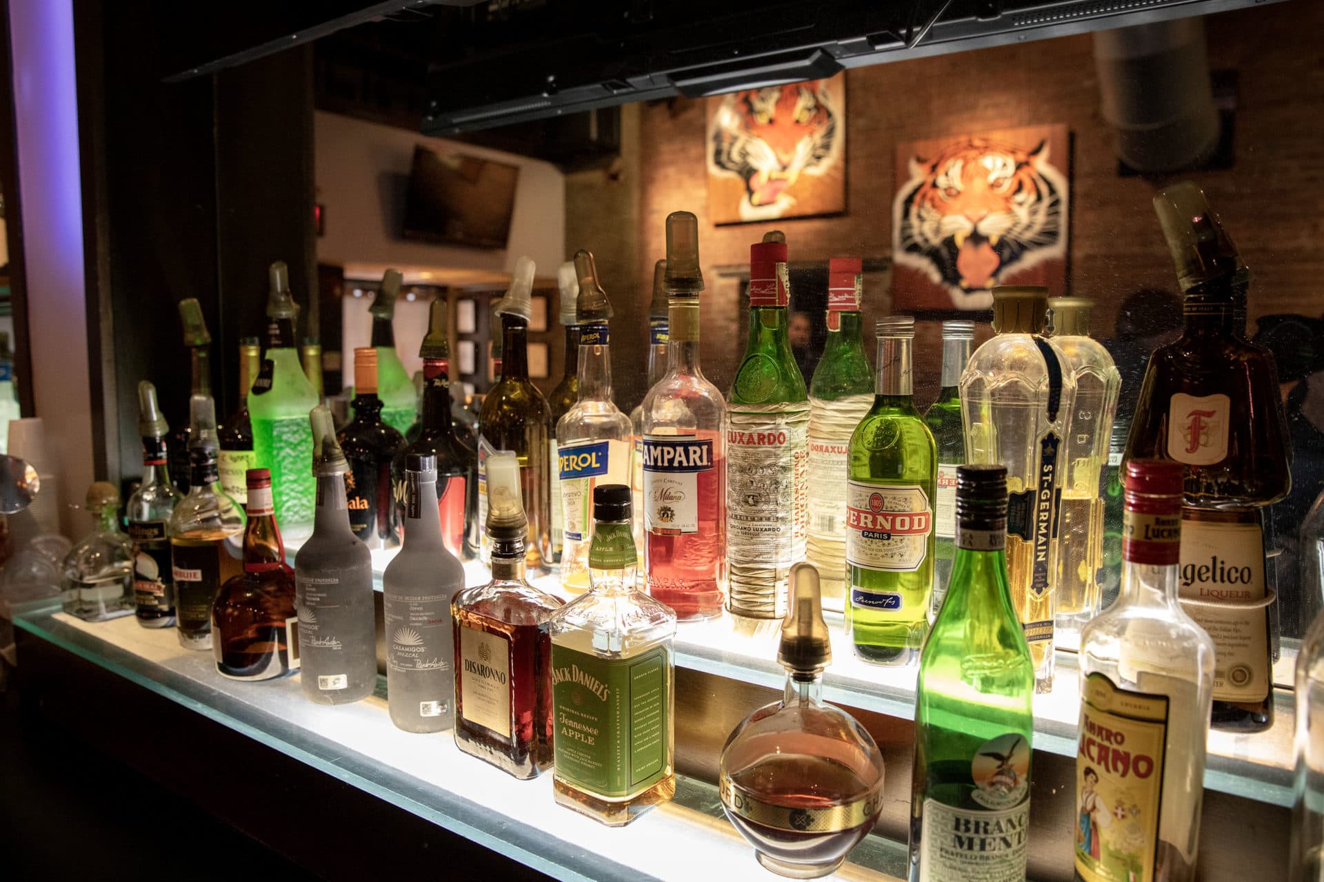 Bottles behind the bar at Good Life on Bedford Street, Boston. (Robin Lubbock/WBUR)