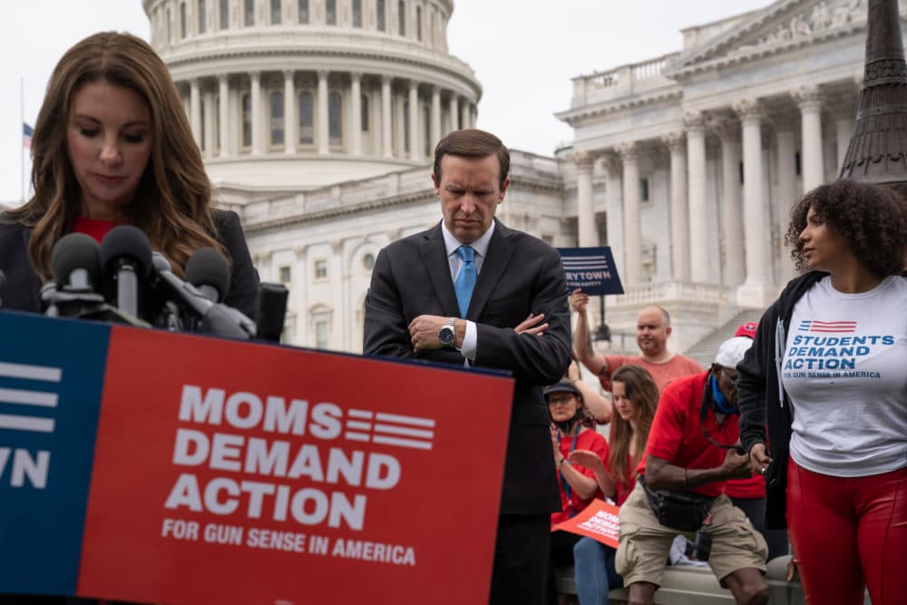 Sen. Chris Murphy, D-Conn., center, and Shannon Watts, founder of Moms Demand Action, left, join activists and other Democrats to demand action on gun control. (J. Scott Applewhite/AP)