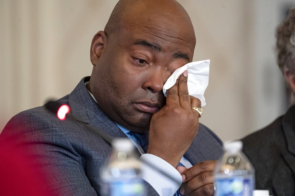 Democratic National Committee chair Jaime Harrison cries while listening to committee member Donna Brazile talk about the importance of proposed changes to the primary system during a DNC Rules and Bylaws Committee meeting. (Nathan Howard/AP)