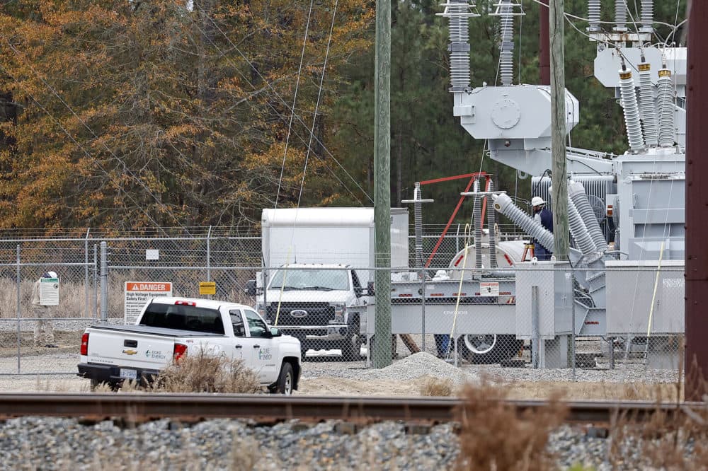 Workers work on equipment at the West End Substation, at 6910 NC Hwy 211 in West End, N.C., Monday, Dec. 5, 2022, where a serious attack on critical infrastructure has caused a power outage to many around Southern Pines, N.C. (Karl B DeBlaker/AP)