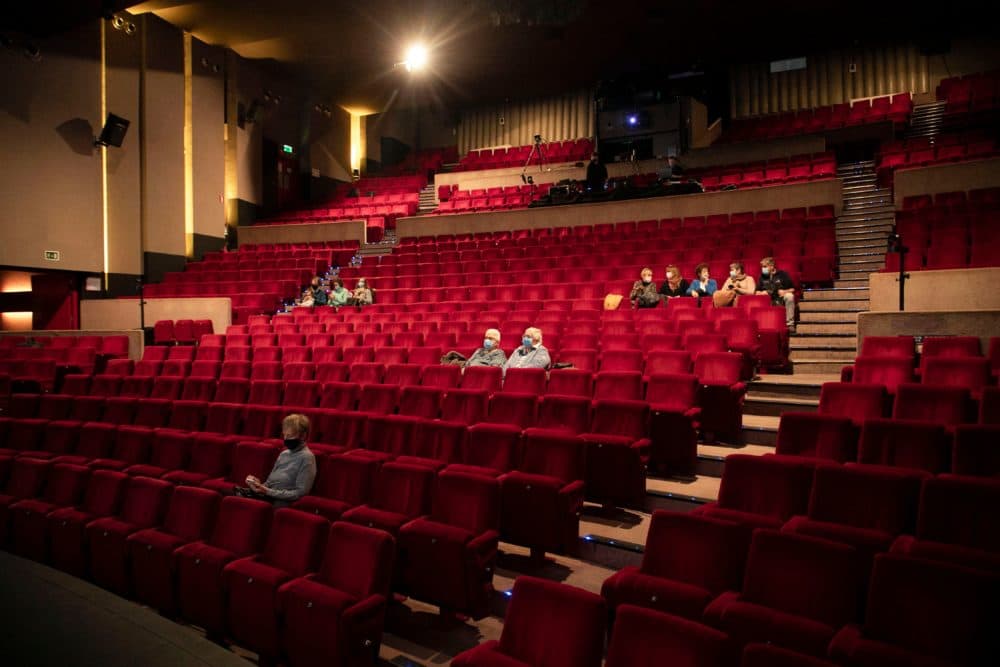 People take a seat for a movie. (Hatim Belga/AFP via Getty Images)