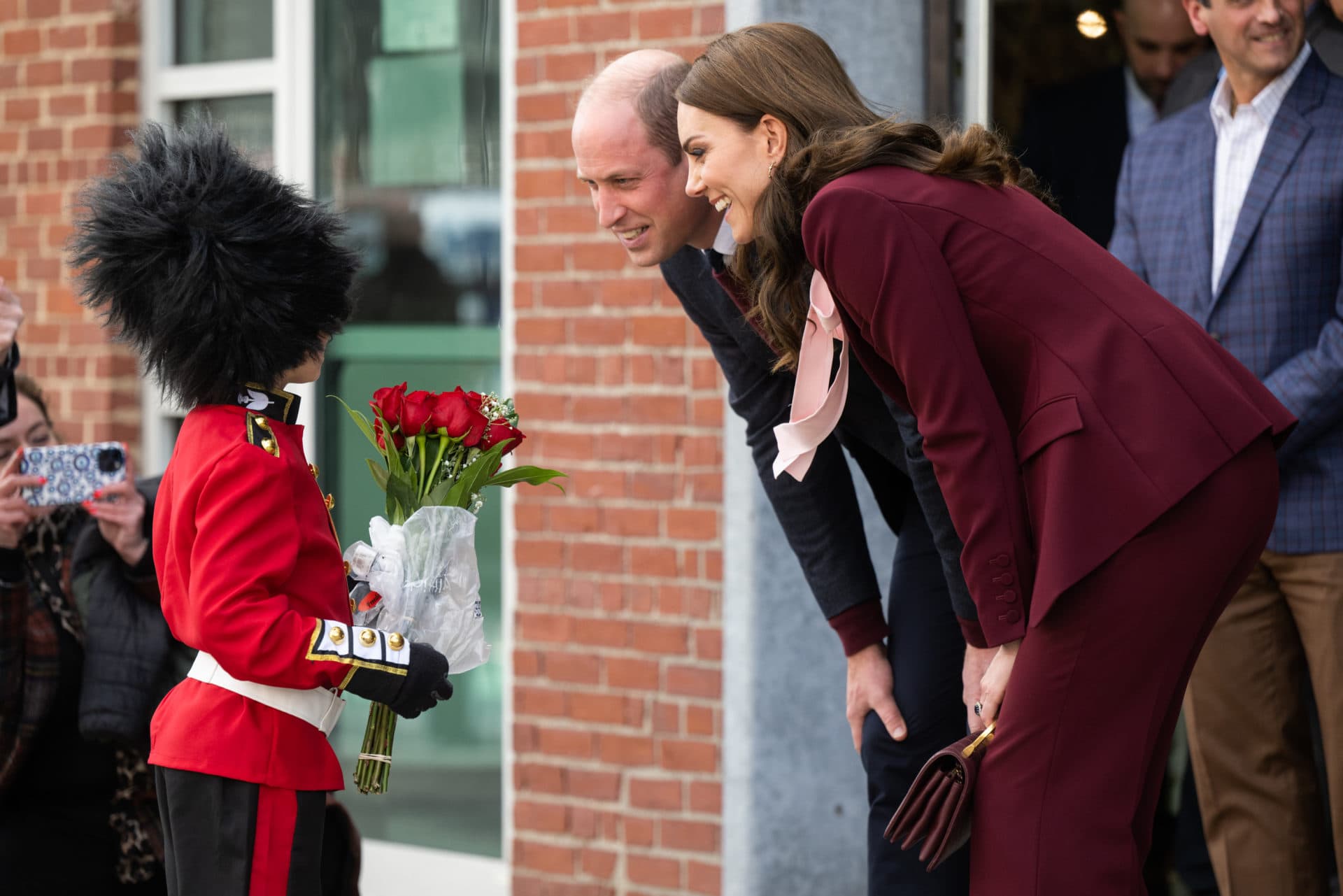 Prince William and Catherine meet a boy dressed as a guard in Boston, Massachusetts. (Samir Hussein/WireImage)