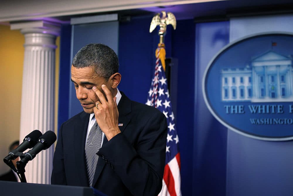 U.S. President Barack Obama wipes tears as he makes a statement in response to the elementary school shooting in Connecticut December 14, 2012 at the White House in Washington, DC. (Alex Wong/Getty Images)