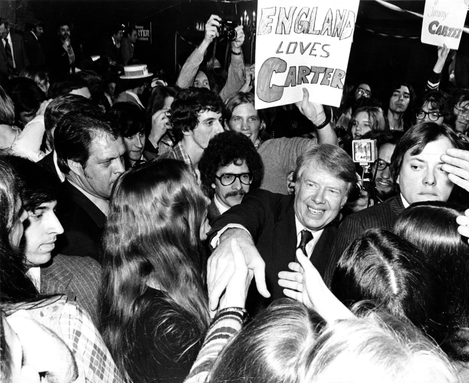 Jimmy Carter greets a crowd at the Carpenter Hotel in Manchester, N.H. in 1976. (Ulrike Welsch/The Boston Globe via Getty Images)