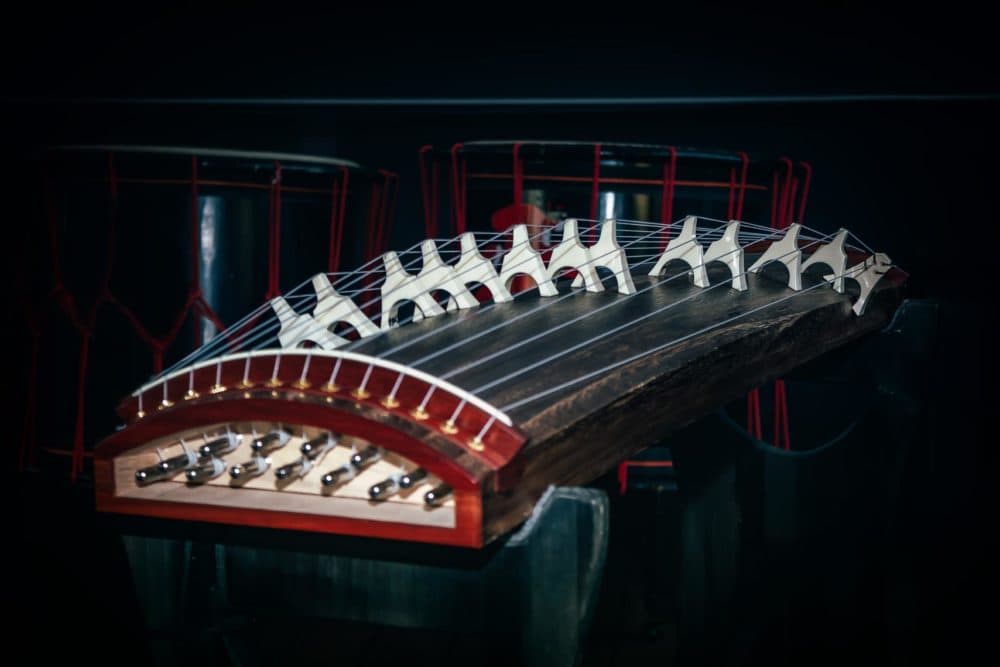 Scholars debate about the guzheng’s origins; some say it was based on a zither made from a single board or bamboo, while others believe it developed independently. (Courtesy of Eric Shimelonis)