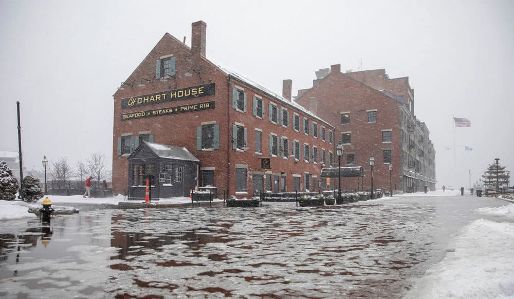 High tide early on Saturday morning during the snowstorm creates flooding on Long Wharf by the Chart House. Credit: Robin Lubbock/WBUR.