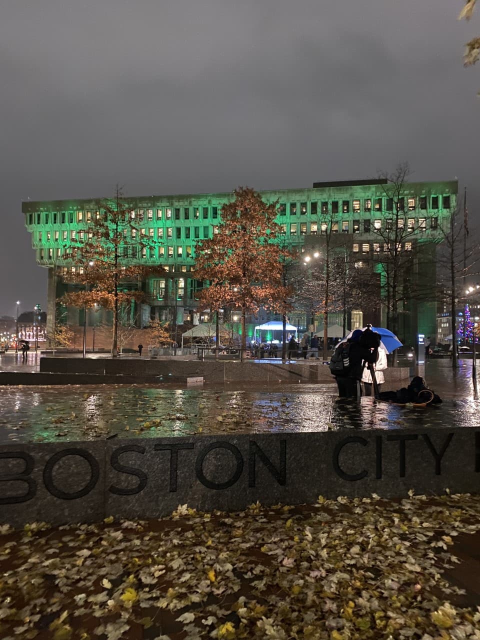 Boston City Hall awash in green light in honor of the 2nd annual Earthshot Prize. (Vanessa Ochavillo/WBUR)