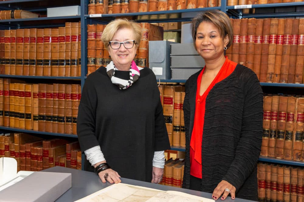 PEM Executive Director and CEO Lynda Roscoe Hartigan (left) and Supreme Judicial Court Chief Justice Kimberly S. Budd examine the Witch Trial documents from 1692. (Courtesy Kathy Tarantola/PEM)