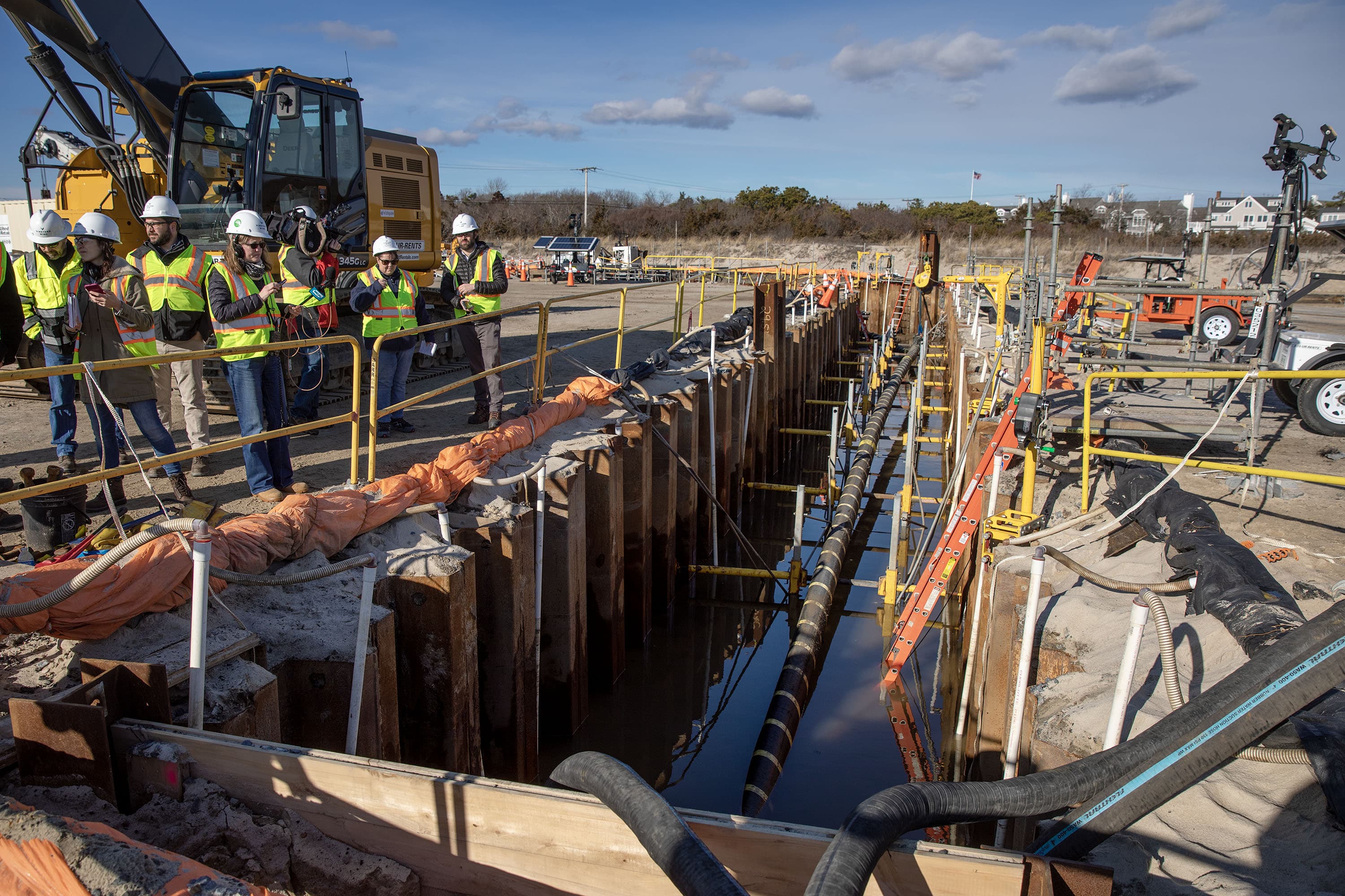 One of the cables that will carry power from Vineyard Wind's turbines comes ashore in a trench at Covell's Beach. (Robin Lubbock/WBUR)