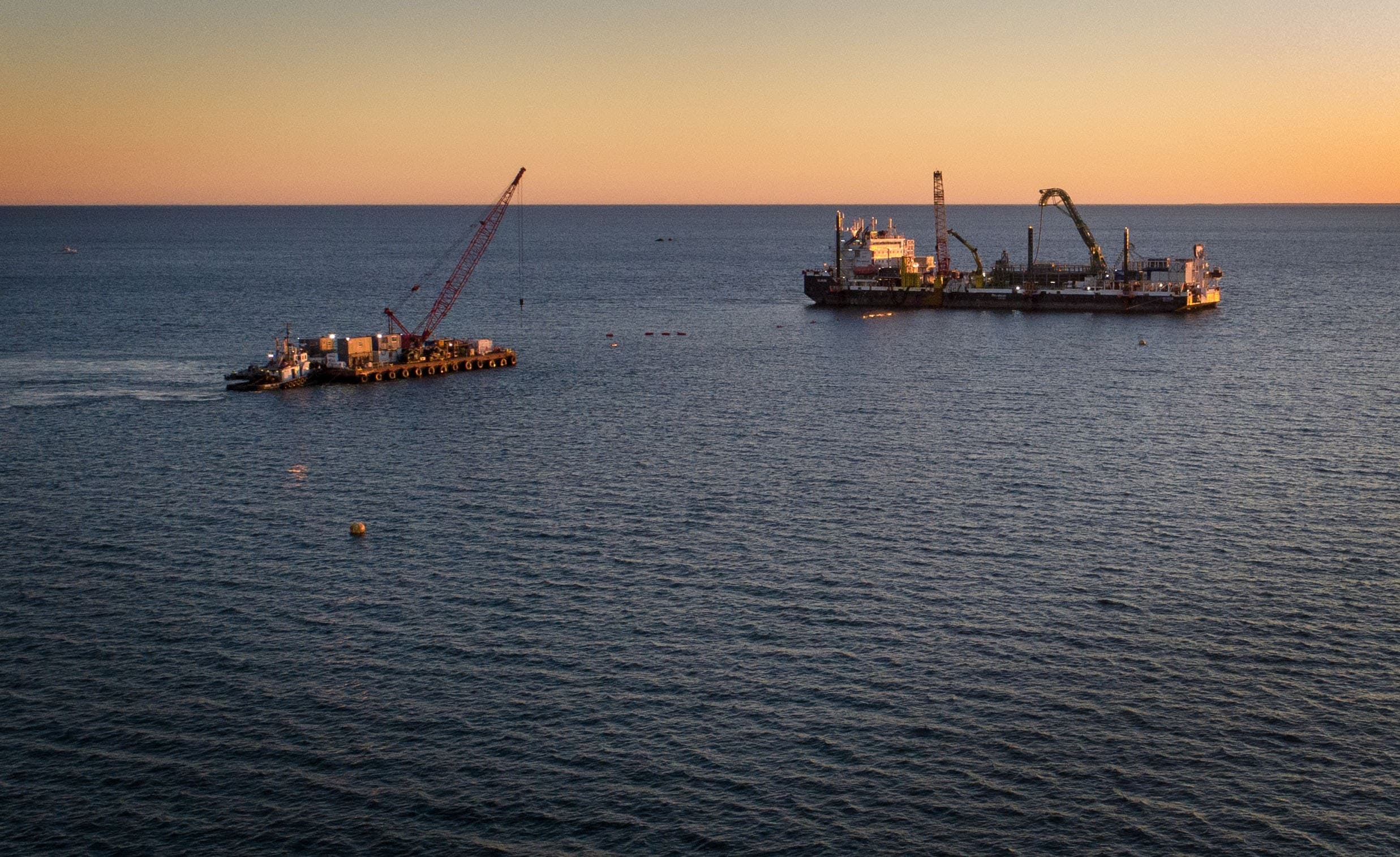 Cable-laying vessels off Covell's Beach in Barnstable. (Robin Lubbock/WBUR)