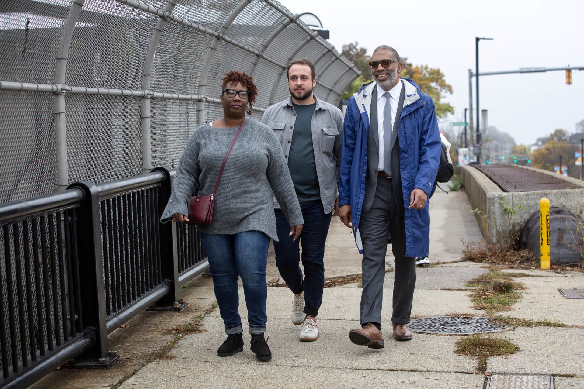 Kenya Beaman, Jared Staley and Arthur Jemison stroll down Blue Hill Avenue. (Robin Lubbock/WBUR)