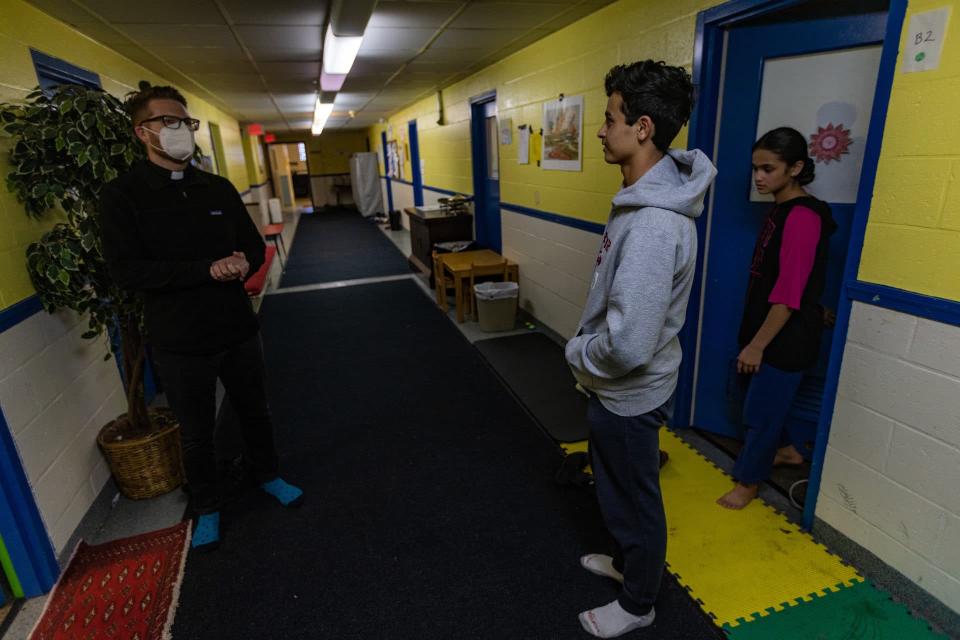 Rev. Jarred Mercer, rector of St. Paul's Episcopal Church in Newburyport, is leading a local effort to find or create housing for the two families of Afghan evacuees that have been staying in the basement of his church for more than a year. (Jesse Costa/WBUR)