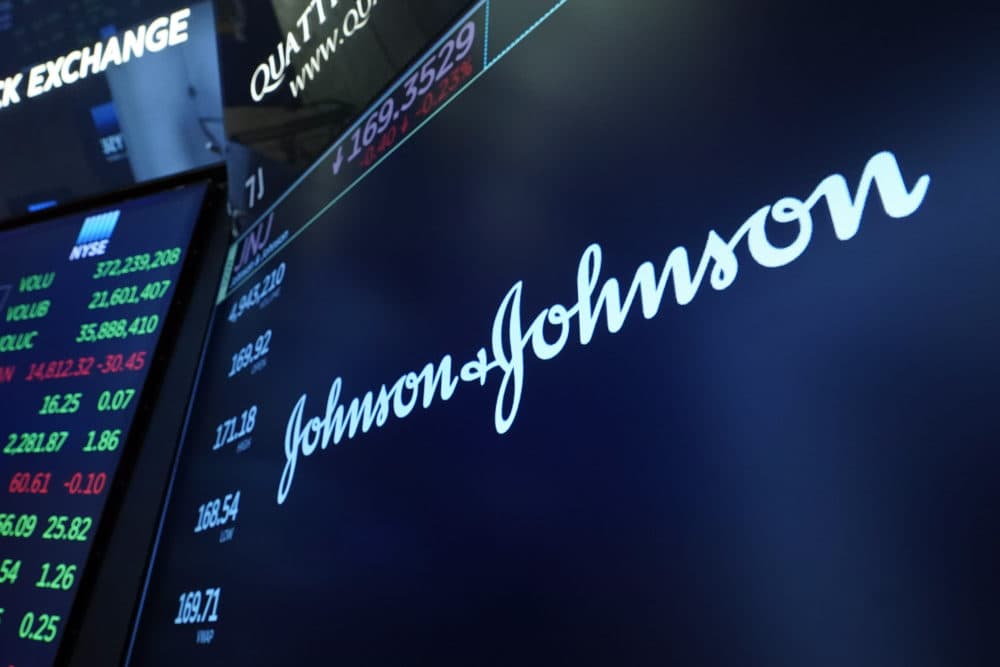 The Johnson & Johnson logo appears above a trading post on the floor of the New York Stock Exchange on July 12, 2021, in New York. (Richard Drew/AP)