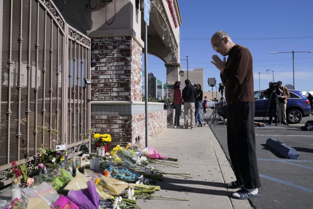 Kenny Loo, 71, prays outside Star Ballroom Dance Studio for the victims killed in Saturday's shooting in Monterey Park, Calif., Monday, Jan. 23, 2023. (Jae C. Hong/AP)