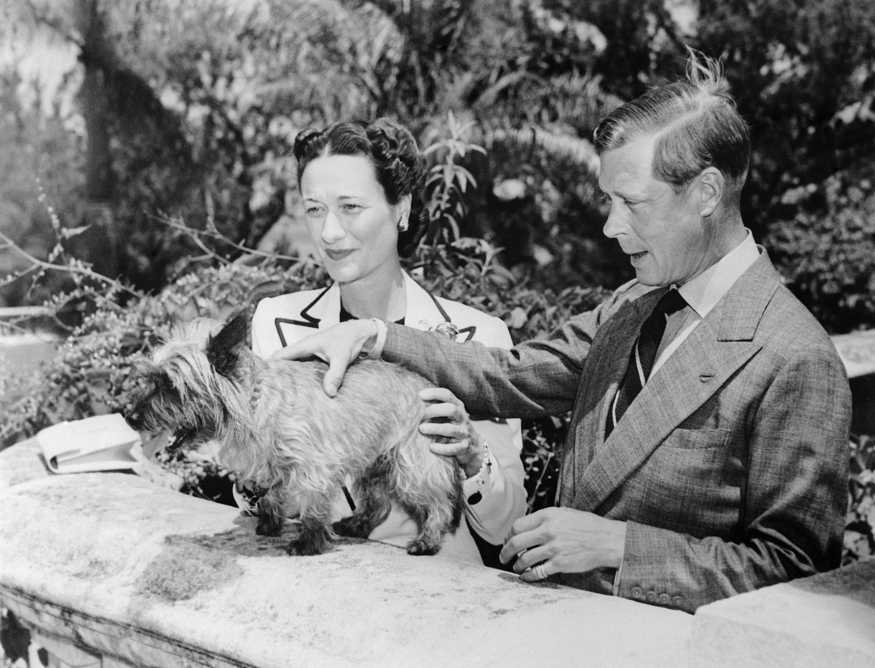The Duke and Duchess of Windsor, Prince Edward and Wallis Simpson, with one of their pet dogs at Government House in Bermuda on Aug. 11, 1940. They are to depart for Nassau where the duke will assume his duties as governor of the Bahamas. (AP Photo)