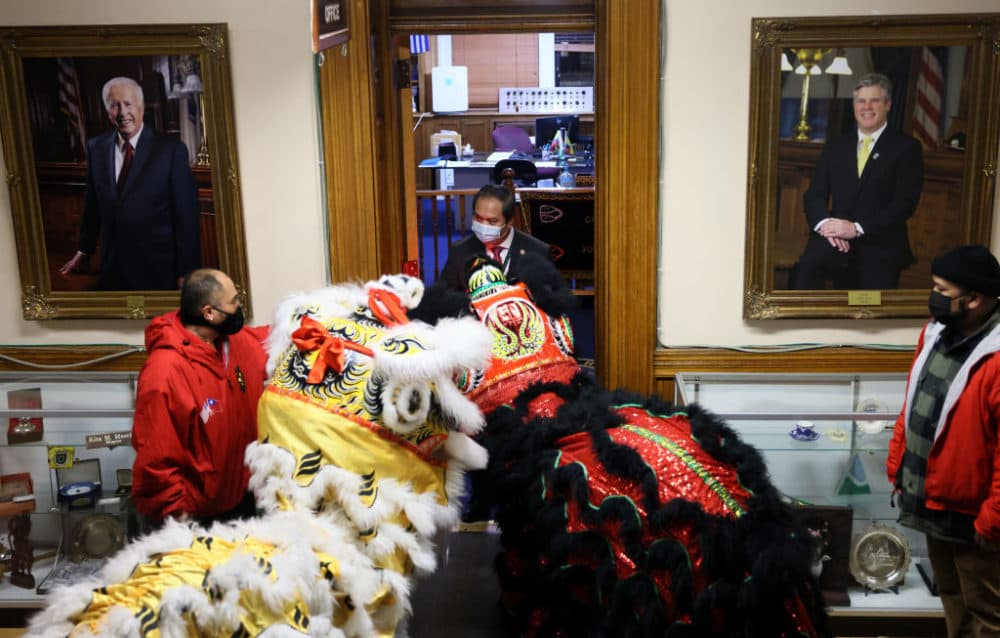 Lowell Mayor Sokhary Chau invites lion dancers into his office at a Year of the Tiger Lunar New Year celebration at City Hall in Lowell on Feb. 1, 2022. (Jessica Rinaldi/The Boston Globe via Getty Images)