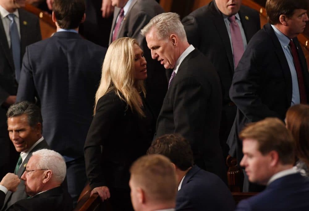 US Representative Kevin McCarthy (R-CA) speaks to U.S. Representative Marjorie Tayor Greene (R-GA) on the floor of the US House of Representatives at the US Capitol in Washington, DC, on January 4, 2023. (Olivier Douliery/AFP via Getty Images)