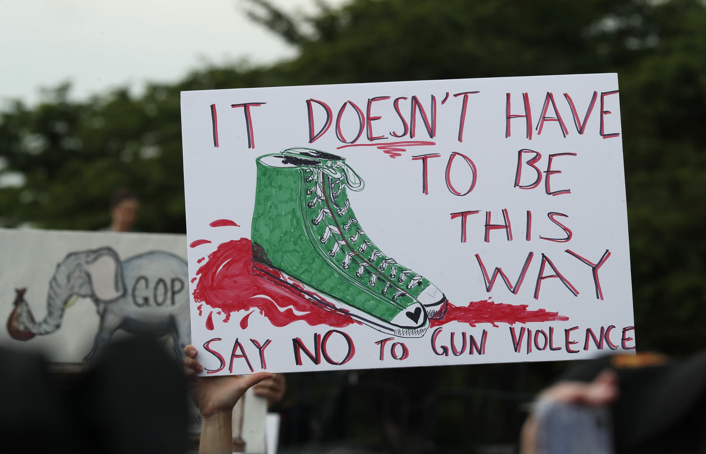 A protester holds up a sign during the March for Our Lives 2022 on June 11, 2022 in Washington, DC. (Paul Morigi/Getty Images for March For Our Lives)