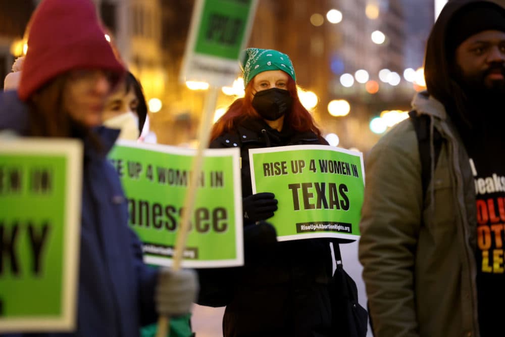 Abortion rights activists protest at the federal building plaza on Dec. 1, 2022 in Chicago. The protest was one of several staged nationwide on the one-year anniversary of the Supreme Court hearing of oral arguments in a Mississippi abortion case that led to a ban on most abortions after the 15th week of pregnancy. (Scott Olson/Getty Images)