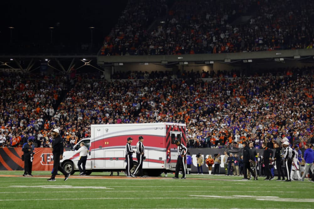 Fans look on as the ambulance leaves carrying Damar Hamlin #3 of the Buffalo Bills after he collapsed during the first quarter at Paycor Stadium on January 2, 2023 in Cincinnati, Ohio. (Kirk Irwin/Getty Images)