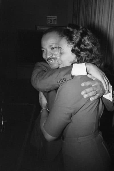 Dr. Martin Luther King, Jr. hugs his wife Coretta during a news conference following the announcement that he had been awarded the Nobel Peace Prize. (Getty Images)