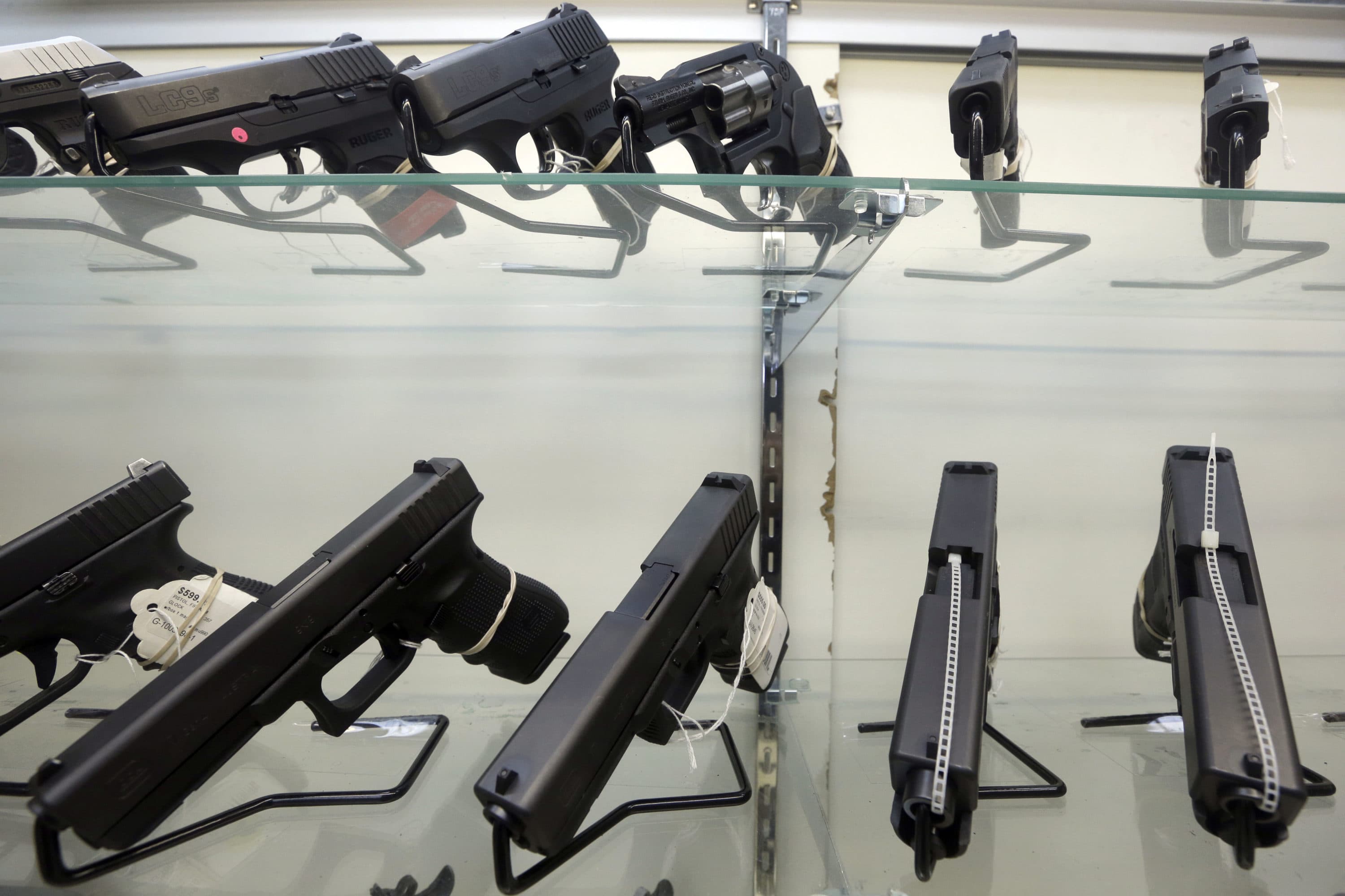 FILE - This June 29, 2016, file photo shows guns on display at a gun store in Miami. Florida lawmakers can fine local government officials who attempt to restrict gun and ammunition sales under a state law upheld by the state Supreme Court on Thursday, Jan. 19, 2023. (AP Photo/Alan Diaz, File)